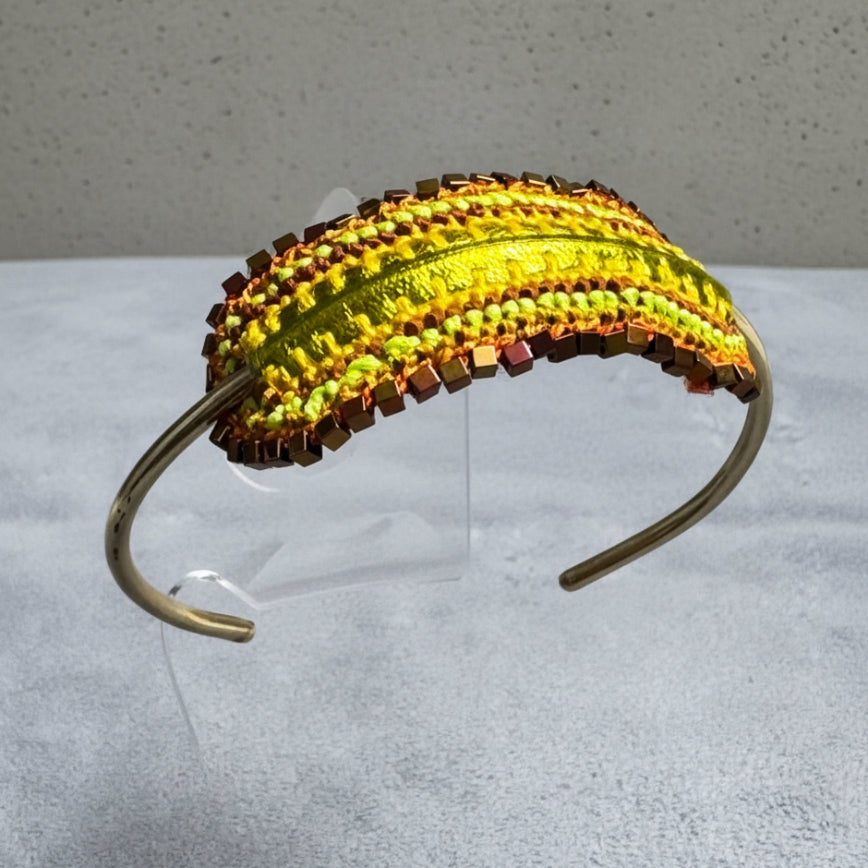 Colorful woven headband on a gray background