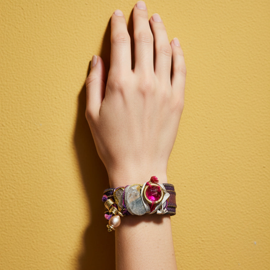 Decorative hair barrette with gemstones on a teal background