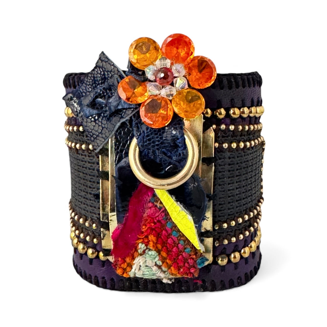 Decorative bracelet with colorful stones and intricate design on a white background
