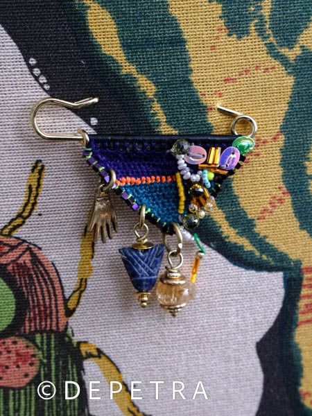 Boho Chic Triangular Pin: A Symphony of Color and Symbolism