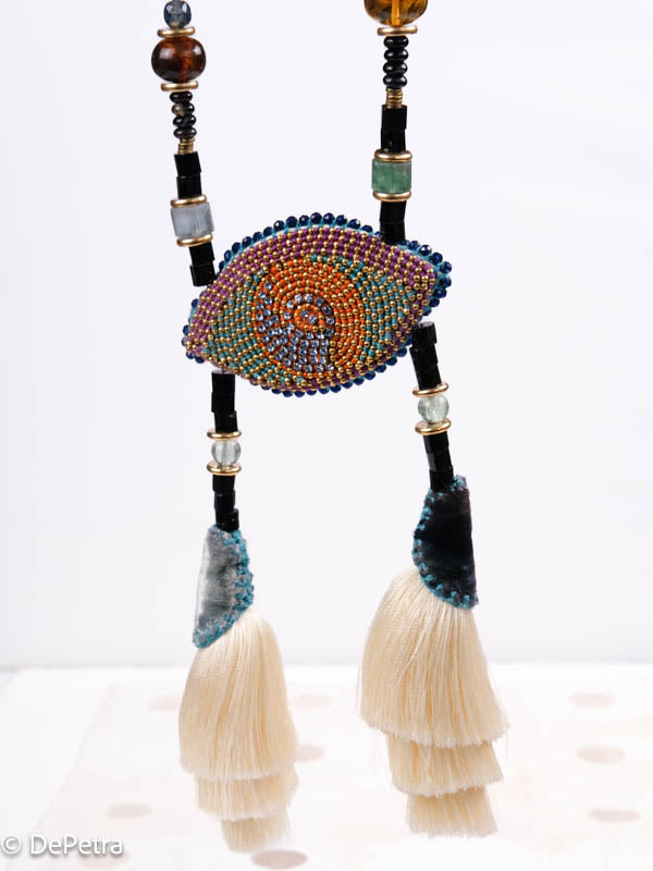 I wear my handmade necklace with tassels and a cosmic eye with blue vintage Swarovskis that made a blue reflection as a reminder of the beauty of the universe.