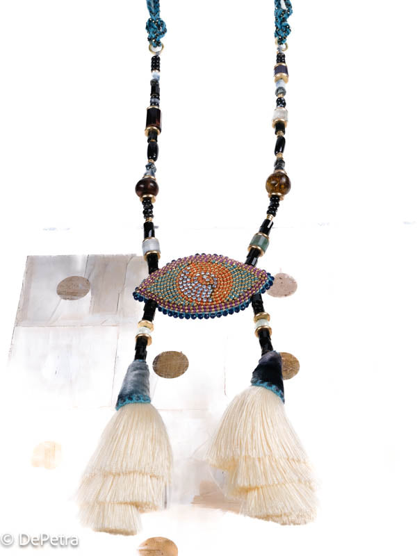 I wear my handmade necklace with tassels and a cosmic eye with blue vintage Swarovskis that made a blue reflection as a reminder of the beauty of the universe.