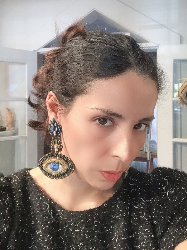 I wear Ojos Magicos earrings to cast a spell of beauty and confidence on myself and the world around me