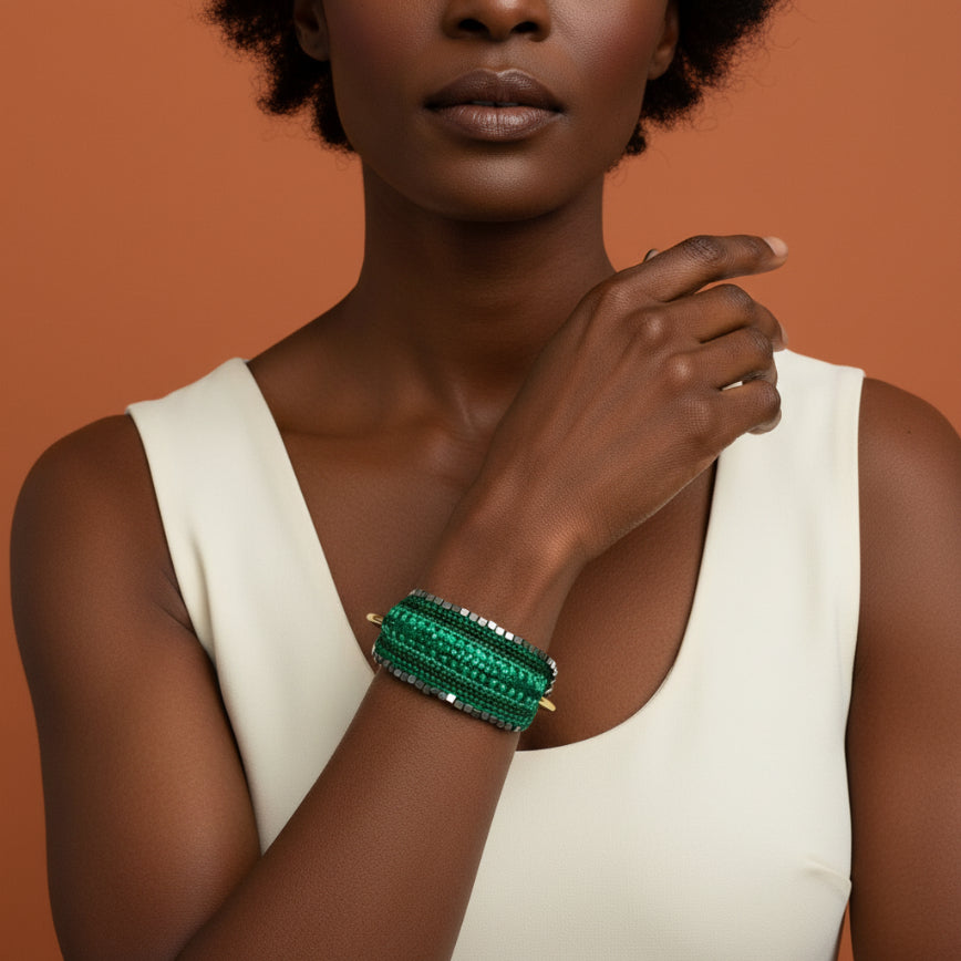 Green beaded headband on a gray surface