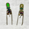 Pair of colorful beaded earrings on a textured fabric background