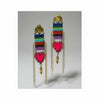 Colorful macramé earrings with heart-shaped charms on a black background
