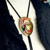Bolo tie with decorative pendant on a mannequin bust